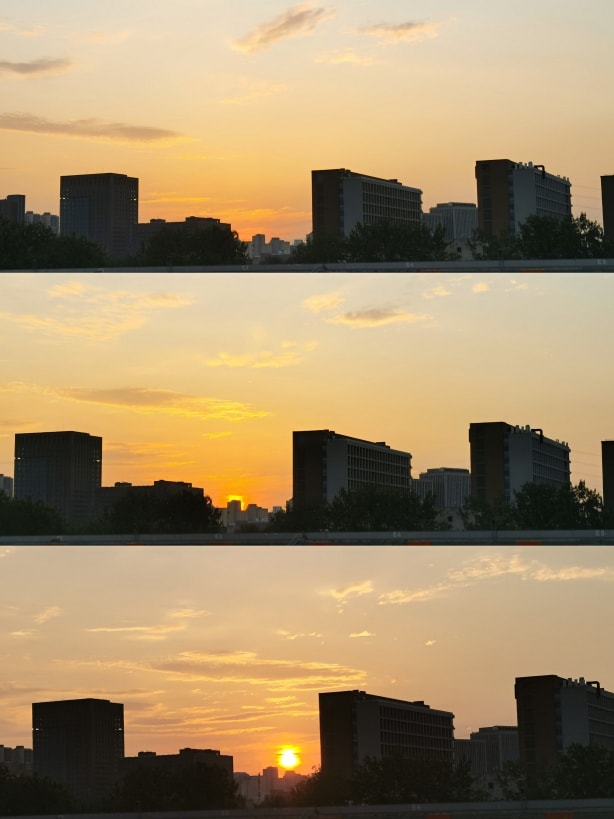 三张纵向的拼图，太阳从建筑剪影之间一点点露出，橙色的光芒照亮天空与缓慢变化的白色云彩。